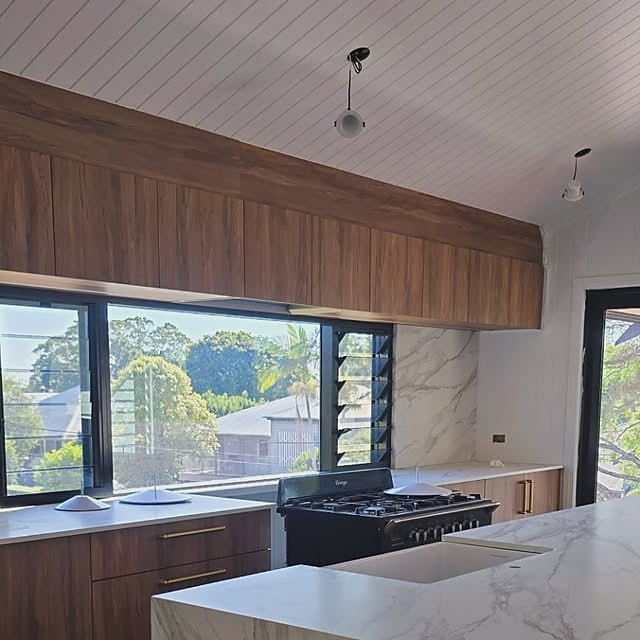 Custom timber kitchen with stone island, designed and installed by Elite Cabinetmakers