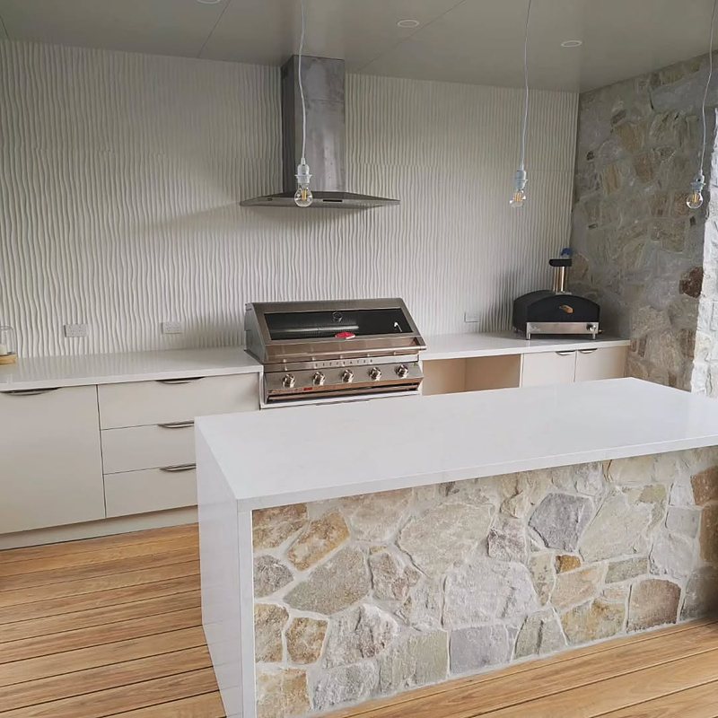 Outdoor BBQ kitchen with stone island bench