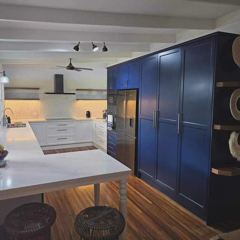 Navy shaker kitchen with full-height cabinetry