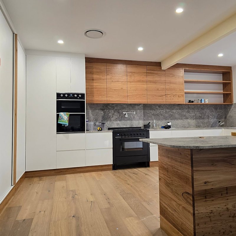 Timber and white kitchen with stone benchtops